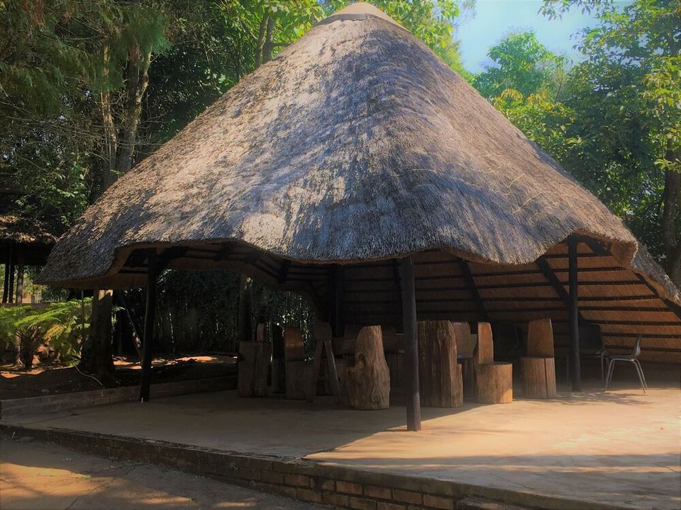 Outdoor seating and braai area in the lodge gardens